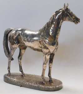 An Elizabeth II loaded silver model of a horse, wearing a bridle and bit, mounted on a... - 2