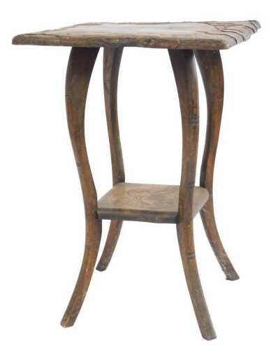 A Japanese style carved hardwood two tier table, the square top, on shaped supports with under...