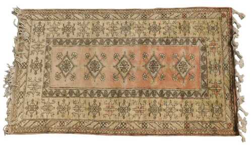 A Turkish rug, with a design of yellow lozenge, on a red ground, one wide and two narrow borders,...