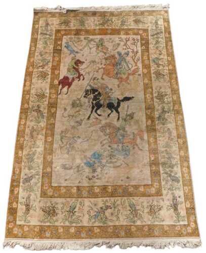 A Persian pictorial rug, decorated with a scene of men on horseback hunting lions, goats,...