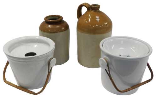 Two late 19th/early 20thC pottery cream glazed slop pails, each with a woven handle, a stoneware...