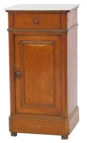 A Victorian oak pot cupboard, with a marble canted top above a single drawer and panelled...