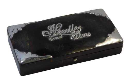 A tortoiseshell and silver-mounted dressing table box, titled Needles & Pins, with hinged lid,...