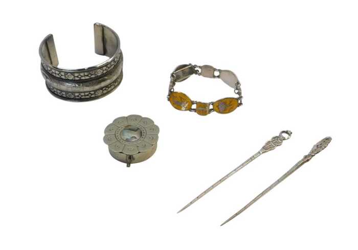 A group of white metal items, comprising an Eastern bangle, a Siam jewellery enamel bracelet,...