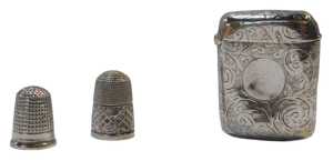 A late Victorian silver Vesta case, decorated with scrolls and leaves, Birmingham 1891, together...