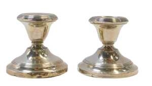 A pair of George V loaded silver candlesticks, of squat form, Birmingham 1922, 3.27oz all in,...