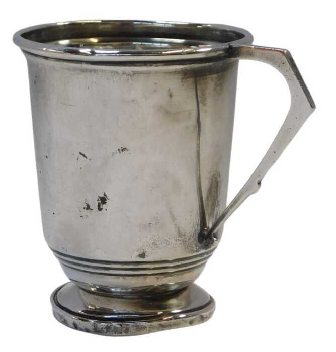 A George VI silver beaker, with lower banded decoration and angular handle, raised on a circular...