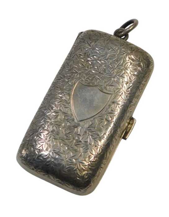 A George V rectangular silver sovereign and half sovereign case, the leaf engraved lid with...