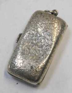 A George V rectangular silver sovereign and half sovereign case, the leaf engraved lid with... - 2