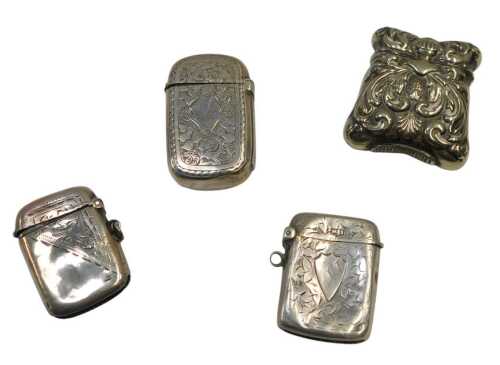A small George V silver Vesta case, Birmingham 1916, with engraved decoration, two other silver...