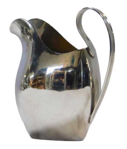 An Edward VII silver milk jug, of plain form, with loop handle and spout, London 1907, 2.38oz.
