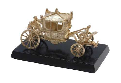 An Elizabeth II silver model of the Coronation State Coach, raised on an ebonised base, Toye,...