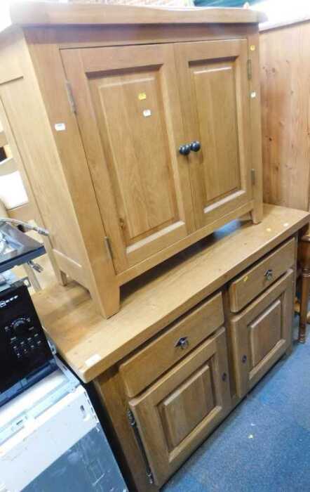 Furniture, comprising a light oak sideboard, two drawers over two doors, raised on square...