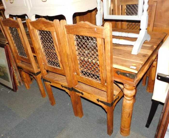 An Indian hardwood dining suite, comprising table, 76cm high, 180cm wide, 90cm deep, and six...