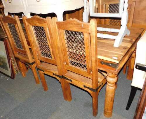 An Indian hardwood dining suite, comprising table, 76cm high, 180cm wide, 90cm deep, and six...
