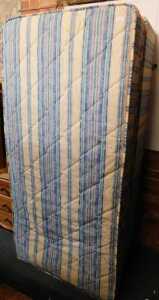 A single divan bed, with a pullout mattress below.