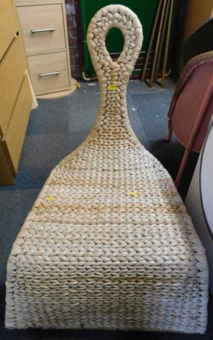A wicker rocking chair.