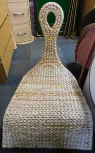 A wicker rocking chair.