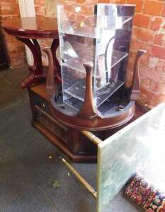 Furniture, comprising a Perspex display cabinet, rectangular in form, with shelves to interior,...
