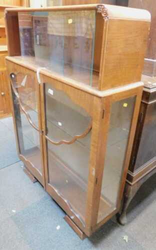 A walnut display cabinet.