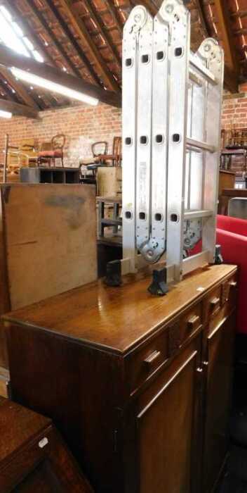 Furniture, comprising a cupboard, of two long drawers over two cupboard doors, shelves to...
