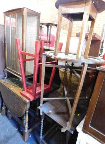 Furniture comprising a mid 20thC display cabinet, with glazed door, over short cabriole supports,...