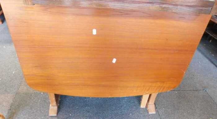 A drop leaf dining table.