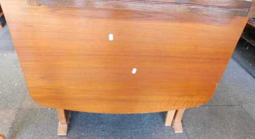 A drop leaf dining table.