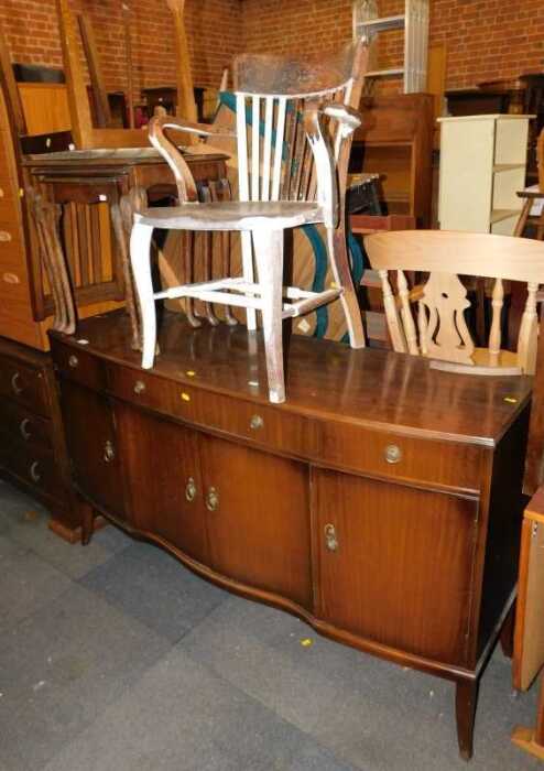 Furniture, comprising a sideboard, of three long drawers over four cupboard doors, raised on...