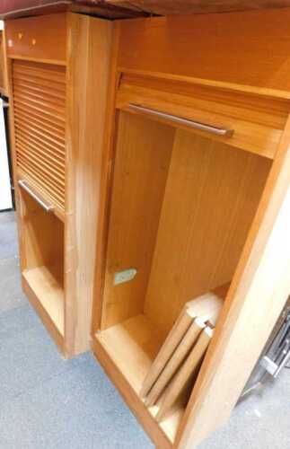 Two tambour fronted units, tambours opening to reveal shelves to interiors.