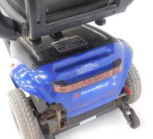 A Wispa mobility scooter, with a blue chassis and charger, with keys. - 4