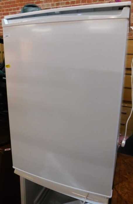 A white finished undercounter freezer.