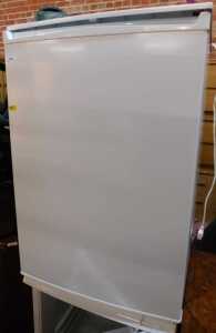 A white finished undercounter freezer.