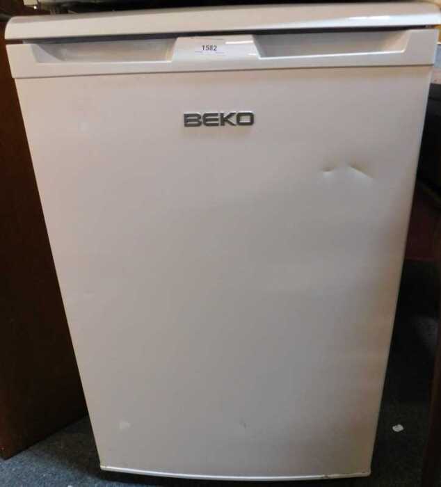 A white finished Beko undercounter fridge.