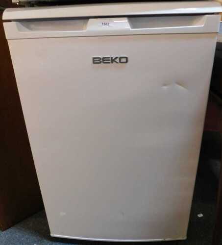 A white finished Beko undercounter fridge.