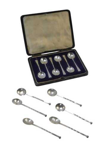 A set of six George V silver coffee spoons, each with a plain handle, Sheffield 1917, in a...