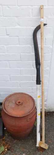 Garden tools, to include a large metal hook, an angled wire brush, and a large terracotta pot...
