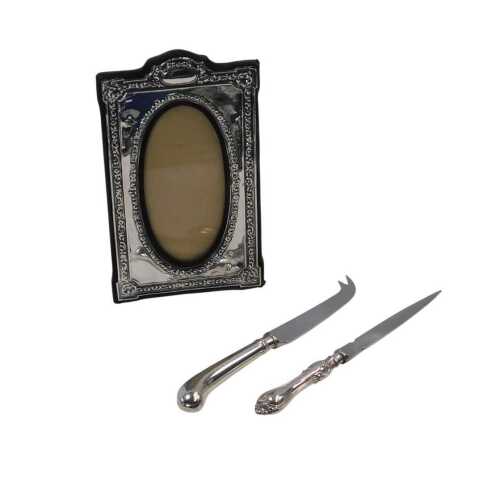 An Elizabeth II silver mounted strut photograph frame, of rectangular form, embossed with...