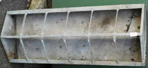 A galvanised metal multi-sectional animal feeder, 93cm wide,