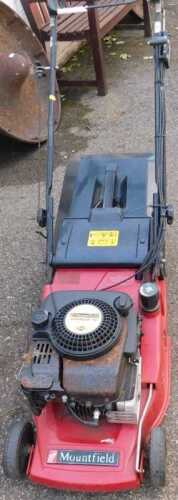 A Mountfield petrol lawn mower.
