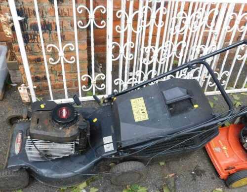 A Lawn King petrol lawn mower, with a Briggs and Stratton engine.