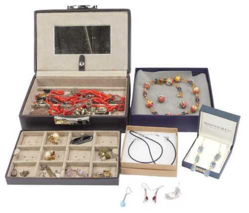 A brown leatherette jewellery box and contents, to include clip on earrings, natural stone drop...