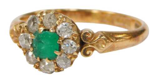 An Edwardian 18ct gold emerald and diamond cluster ring, set with an asscher-cut emerald 4.2mm x...