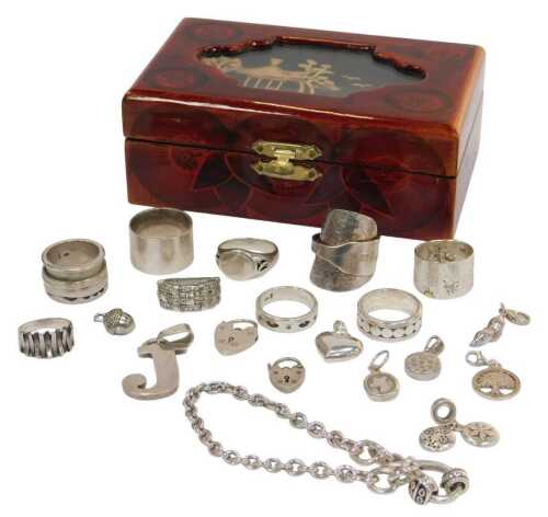 An Eastern inspired jewellery box and contents of silver jewellery, comprising a silver...