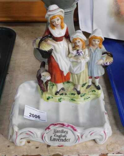 An early 20thC Yardley English Lavender porcelain soap dish, banded by three figures and a dog,...