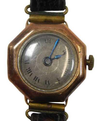 A 1950s 9ct gold cased wristwatch, with an octagonal dial and silvered Roman numeric face, with...