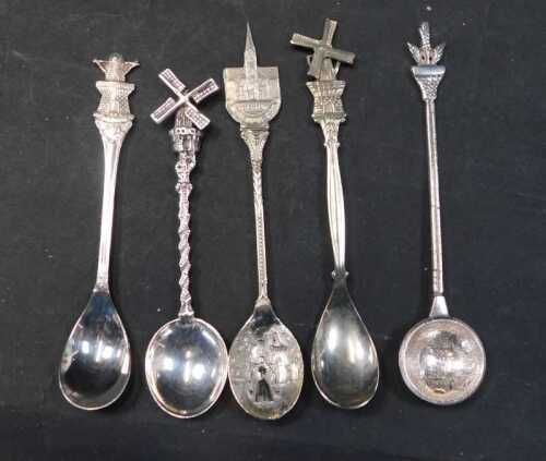 A group of white metal spoons, to include three Dutch examples, each terminal decorated with a...