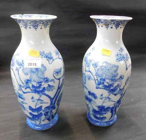 A pair of blue and white Oriental inspired vases. (AF)