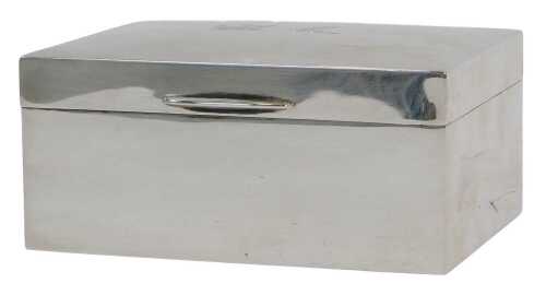 A George VI silver cigarette box, of rectangular form, with crests to the lid and plain cedar...