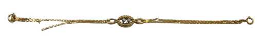 A 9ct gold two row bracelet, the central twist links set with two tiny diamonds, bearing import...